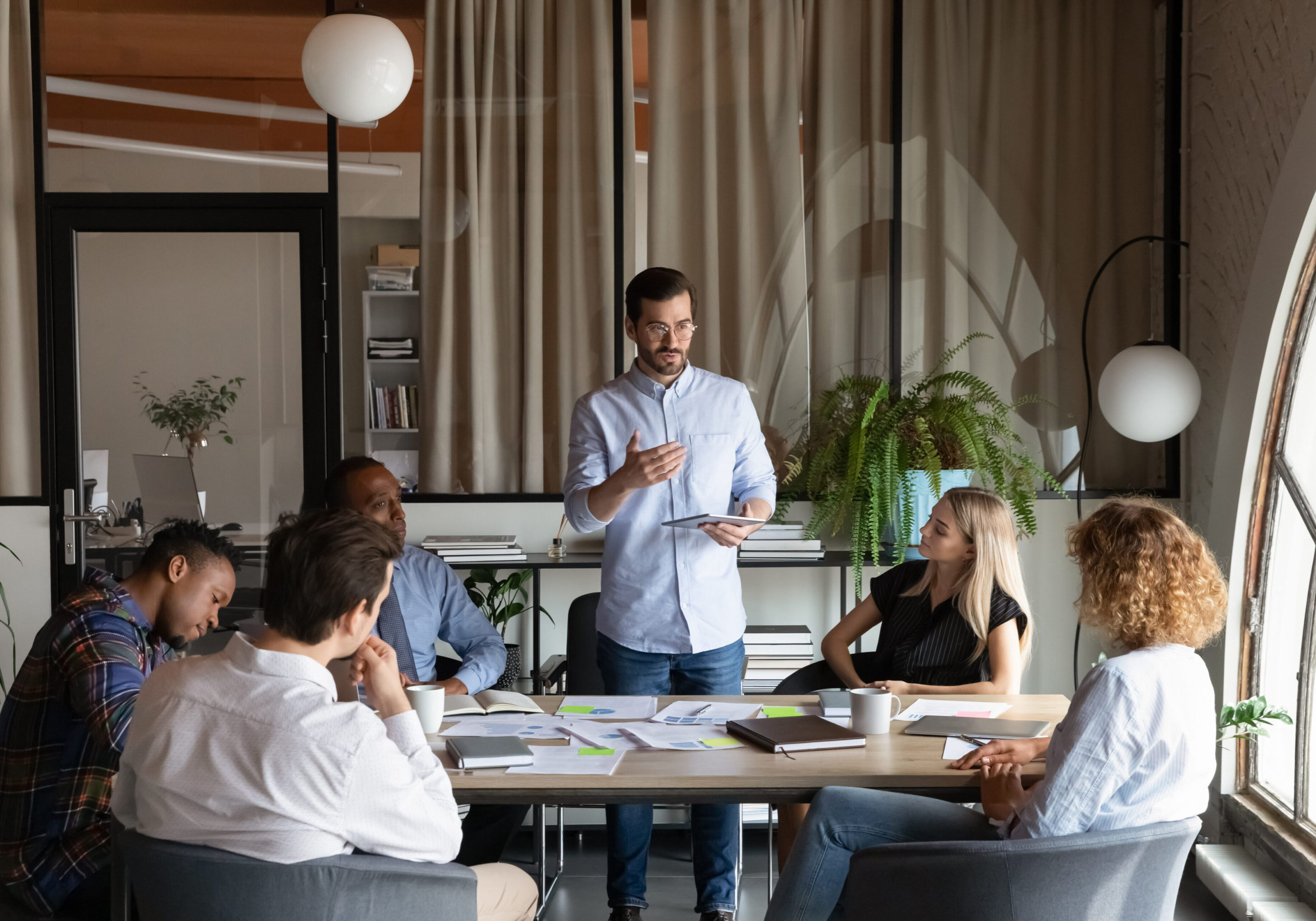Team meeting in modern office setting.